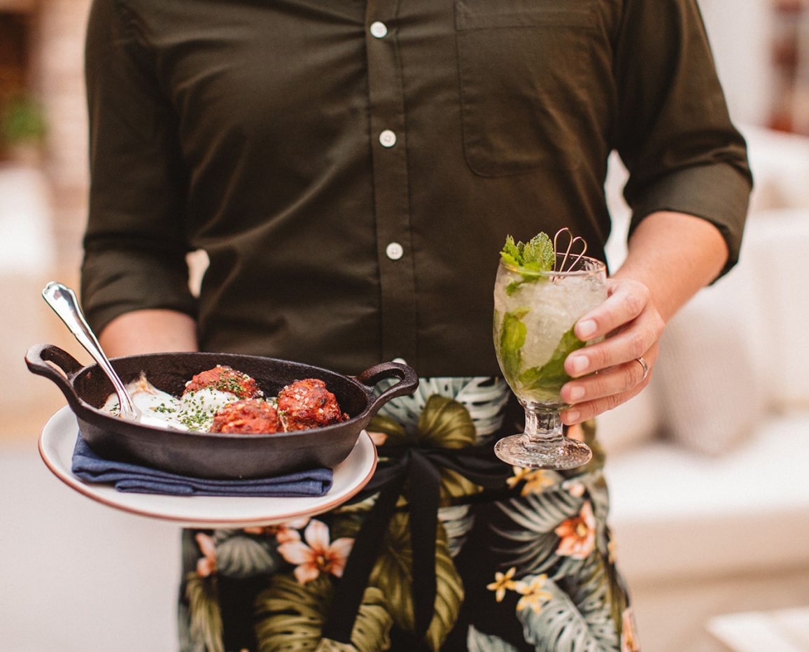 Waiter serving food and drink.